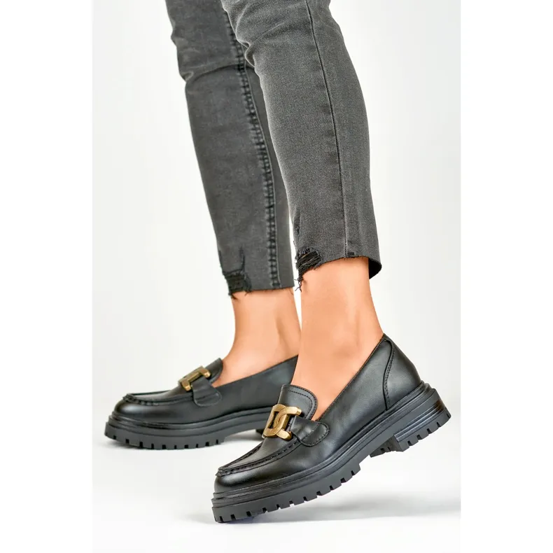 Mocassins noirs à boucle dorée le noir